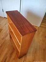 Angled side and top view of bookshelf