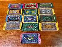 Top view of entire group of miniature felt rugs arranged on table