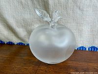 Front view showing frosted apple body and clear leaves
