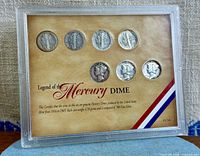Front view of framed set showing all coins and label