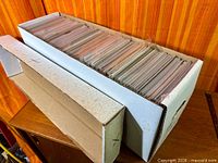 Long white comic longbox filled with bagged and boarded comics