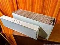 Long and short comic storage boxes, both full