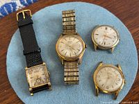 All four Gruen watches displayed on felt pad