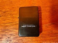 Front of lighter showing Jagged Little Pill 25th anniversary text