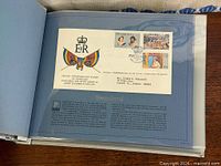 Open page showing Swaziland Silver Jubilee first day cover