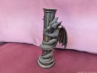 Bronze-finish candle holder with dragon on column