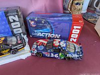 #36 patriotic car, 2001 box, partial view of #2 car and 2002 box