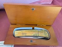 Stag scene folding knife in cedar-tone case