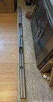 Full view of 72" Stanley FatMax level on floor