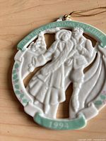 Front view of porcelain ornament showing design and date