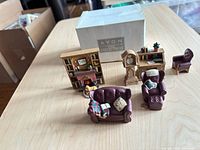 overview of all seven miniature furniture pieces with box in background