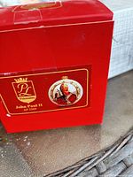 Front of red Polonaise box showing product label with Pope John Paul II image