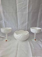 Front view of two compotes and bowl showing pattern, shape, and matching design