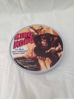 Top view of round tin with King Kong artwork