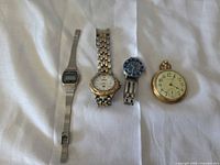 Front view of all four watches displaying dial designs and styles