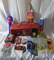 Overall lot with toolbox, brush, caulk, funnel, hardware spread
