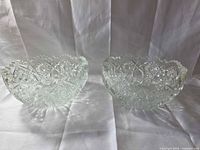 Pair of clear cut glass bowls side by side