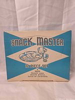 front of original Snack Master 12-Piece Set box
