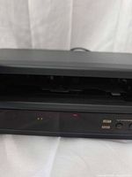 Front view with cassette door open showing internal mechanism