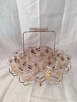 Front view of complete barware set showing glasses, ice bucket, and caddy