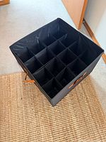 Top view showing 16 compartment grid inside bin