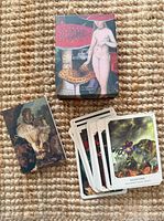 Deck, guidebook and box displayed; sample cards fanned