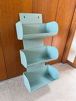 front view showing three tiers and turquoise color