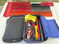 Entire lot displayed; case open with contents, plug trays visible