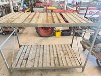 Full view of assembled gray metal rack showing two shelves and frame