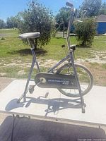 Side view of complete Healthmaster 250 exercise bike on table