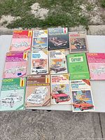 Group shot of all 14 manuals laid out on table