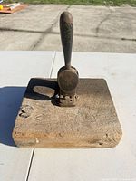 Top view of punch mounted on wood block