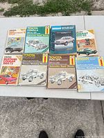 All nine manuals laid out on table