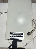 Manufacturer label showing brand, model, voltage and current