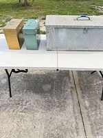 All three boxes side by side on table