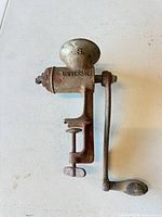 Full view of grinder showing clamp, body, and handle