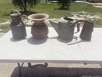 Group shot of all four metal items on table