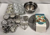 Overview of all bakeware items including mixing bowls, muffin pans, Cozy Village pan, cookie cutters and gelatin molds