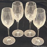Group shot of four Waterford Lismore wine glasses