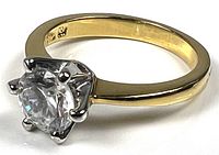 Oblique view showing stone, prongs and band