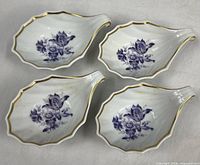 Top view of four Richard Ginori leaf dishes