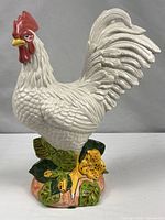 Full view of ceramic rooster figurine showing overall design and base