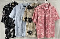 All four shirts hung side by side showing front patterns