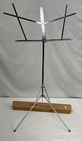 Full view of assembled chrome music stand with original box behind