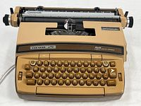 Full view of typewriter showing body, keyboard and carriage