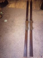 Full view of both wooden skis