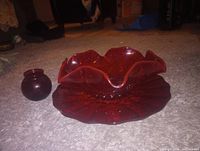 Bowl on underplate next to bud vase showcasing size and color