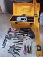 Overall view of toolbox and assorted hand and power tools laid out