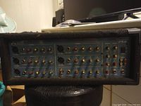 Front view of Wharfedale Pro PM600 powered mixer showing all input connectors and controls