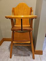 Front view showing full chair, tray, legs